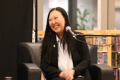 An author smiling at a question