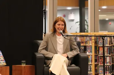 An author answering a question on the stage.